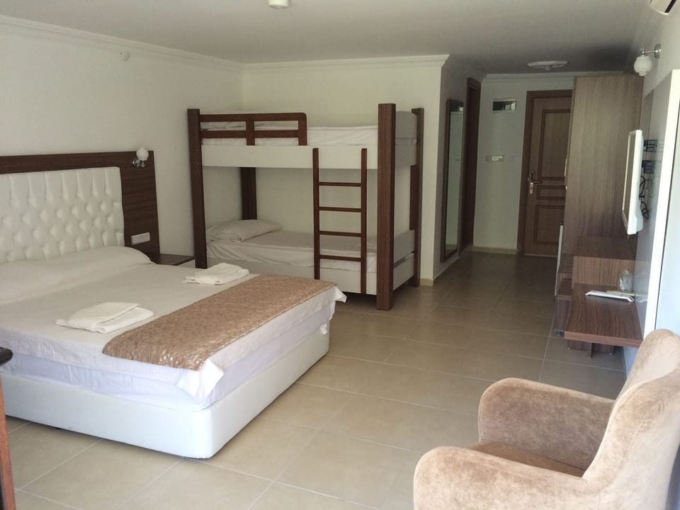 Family Room | In-room safe, desk, rollaway beds (surcharge), WiFi (free)