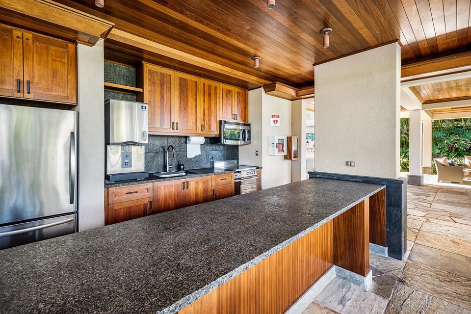 Large outdoor kitchen.  Nice place to enjoy family or friends close to the pool.