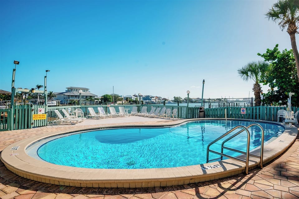 Heated waterfront pool with beautiful harbor views. Pool lift available.
