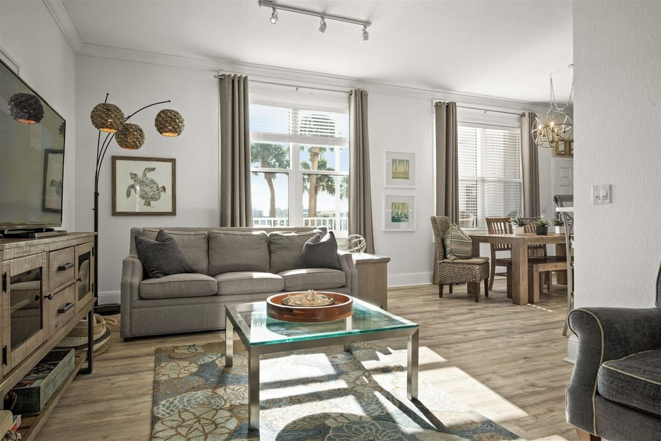 Bright, open living room with sparkling bay views.