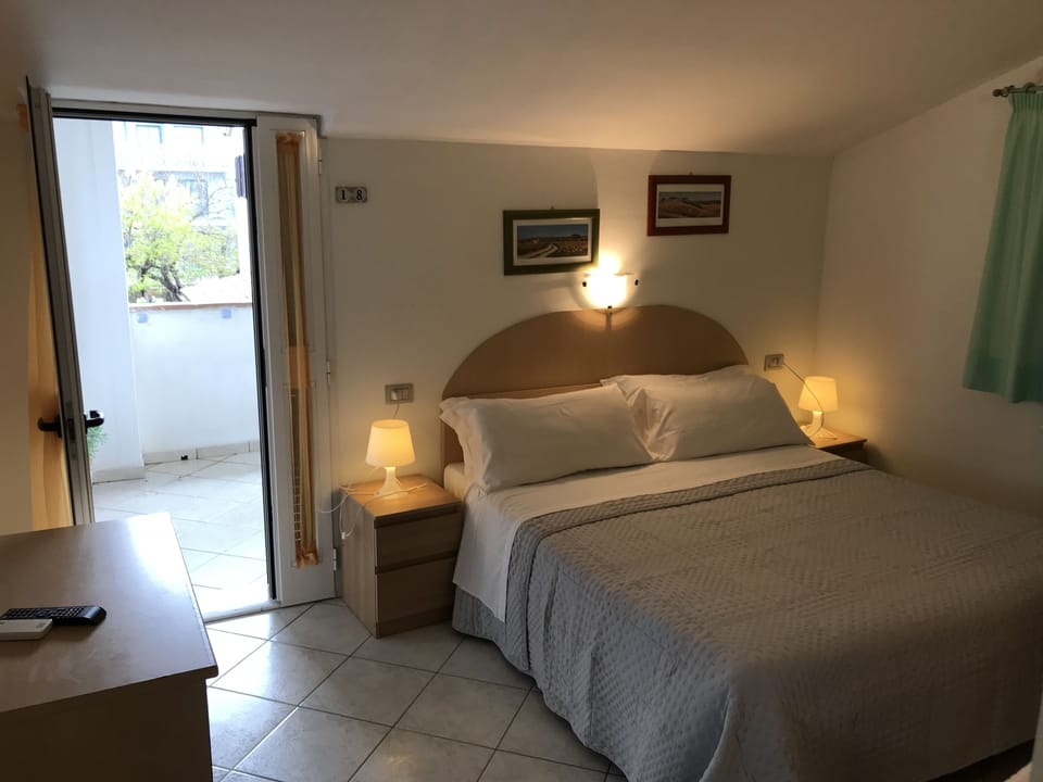 Standard Double Room | Minibar, desk, iron/ironing board, rollaway beds