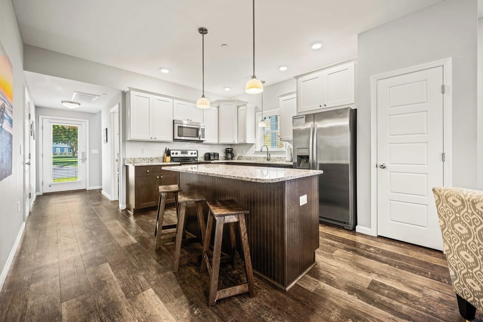 Kitchen with Bar Stool Seating on First Level
