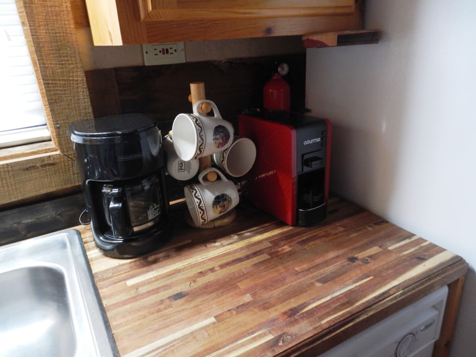 Coffee maker- coffee mugs-arcacia wood counter (ark of covenant wood) 