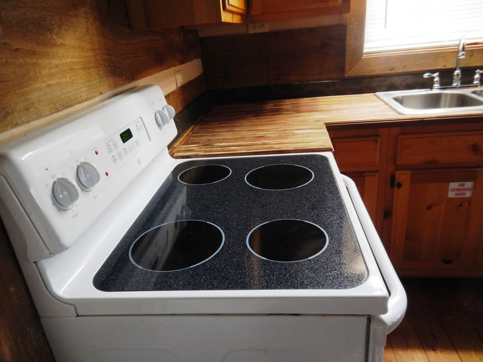 Kitchen stove/arcaia wood counter and sink 