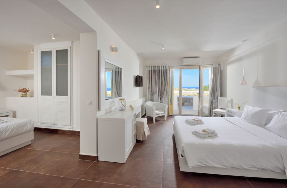 Quadruple Room, 2 Bedrooms | In-room safe, bed sheets