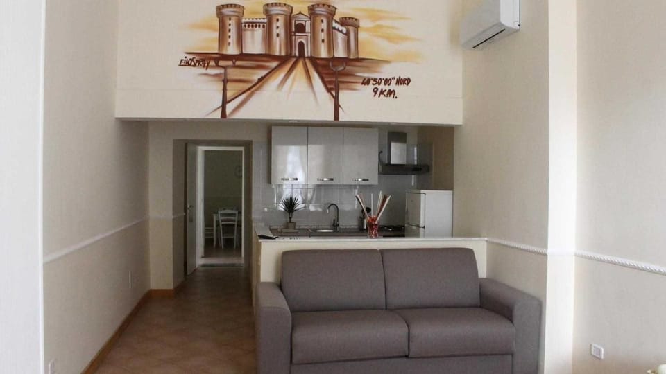 Family Quadruple Room, Balcony | Living area | Flat-screen TV