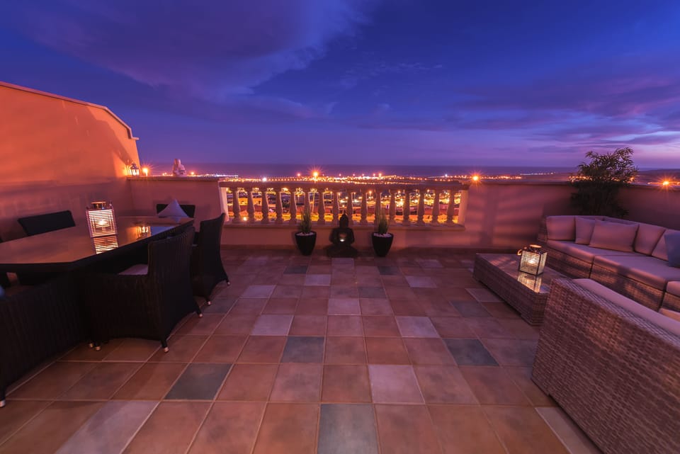 Lounge terrace with sun going down, sunning views.