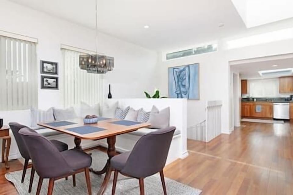 Alternative view of dining area and stairs to the lower level.