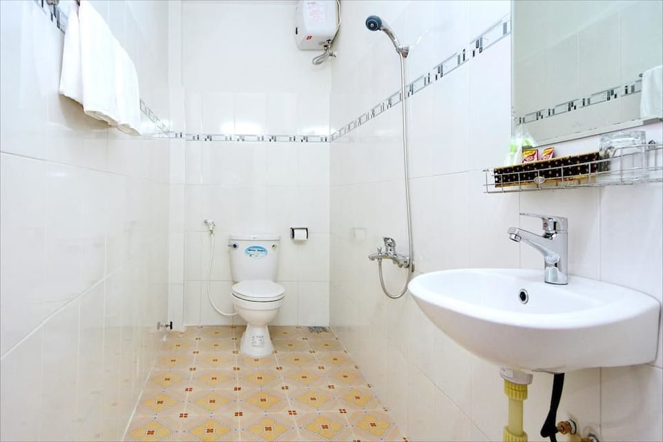 Shower, free toiletries, hair dryer, slippers