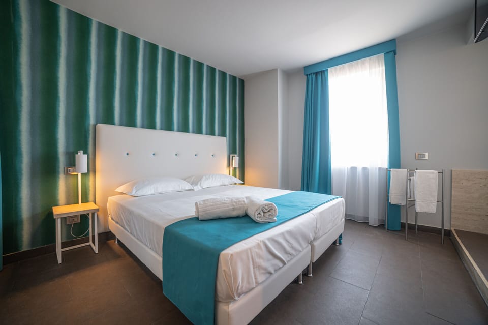 Deluxe Room (Top Floor) | Down comforters, minibar, in-room safe, blackout drapes