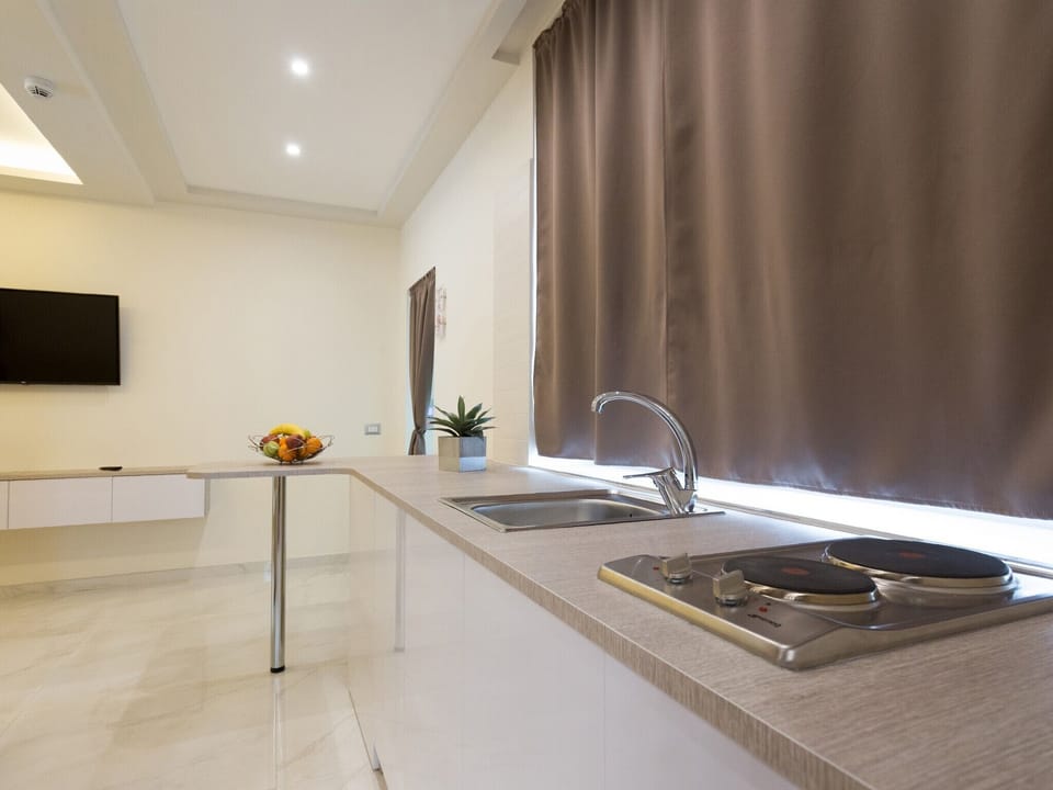 Standard Quadruple Room, 1 Bedroom | In-room safe, desk, free WiFi, bed sheets