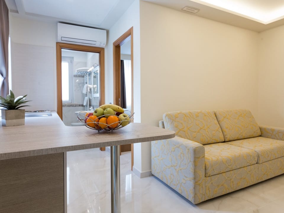Standard Quadruple Room, 1 Bedroom | In-room safe, desk, free WiFi, bed sheets