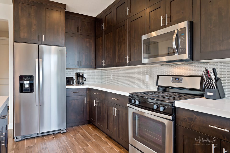 Stainless appliances, coffee maker, toaster, griddle, blender, mixer. 