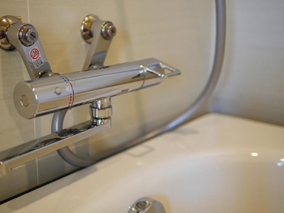 Gallery Quadruple Room, 2 Queen Beds, Accessible | Bathroom | Rainfall showerhead, free toiletries, hair dryer, slippers