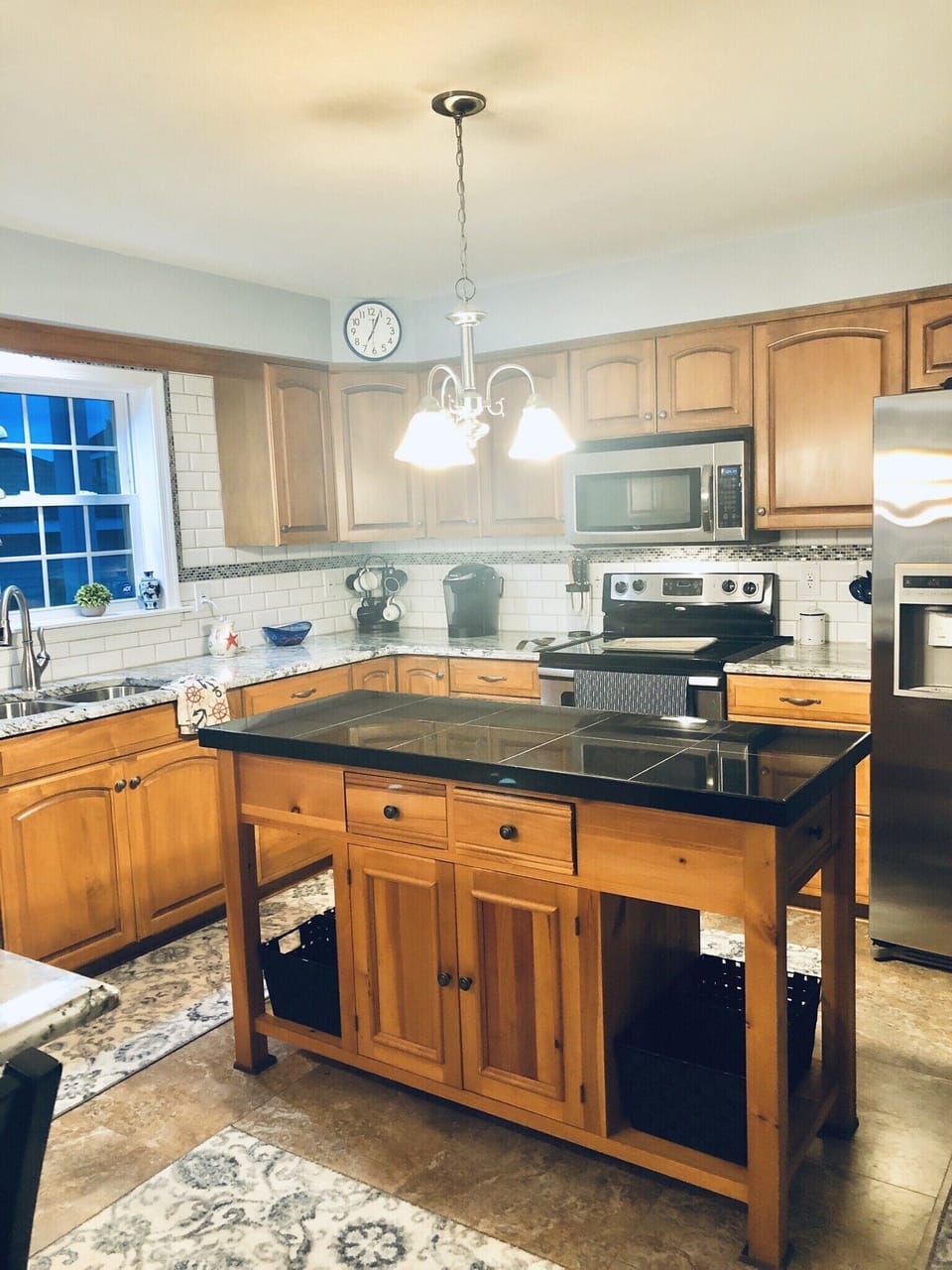 Granite center island, stainless appliances & many more convenient appliances