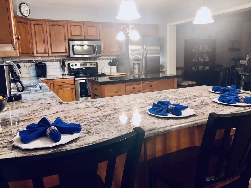 New granite in kitchen added winter 2020!  Comfortable kitchen seating for 12. 