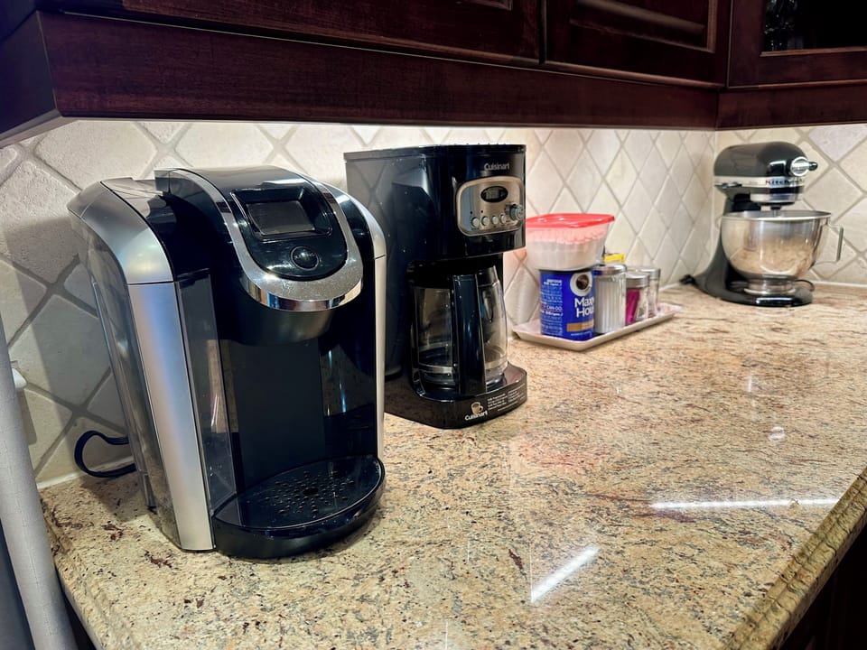 Two coffee makers available, A Keurig and a regular 12 cup dripping machine.