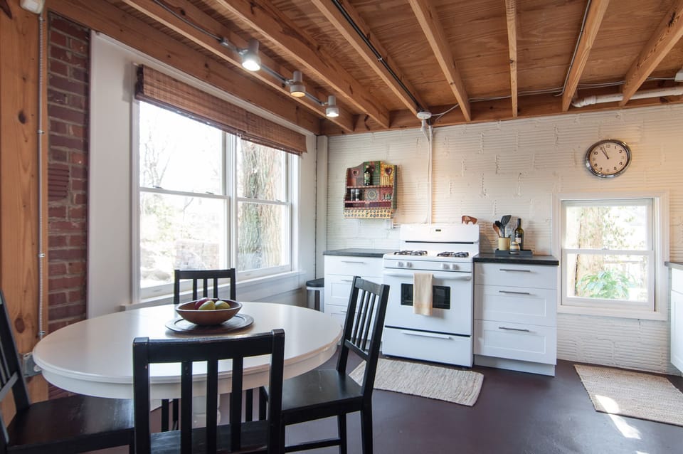 Morning sun through large windows in kitchen/dining area.