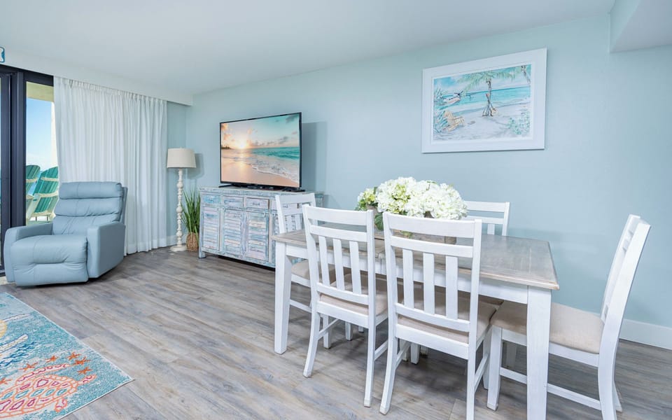 Gather in this living and dining area for a fun family game or movie night after your daily beach adventures