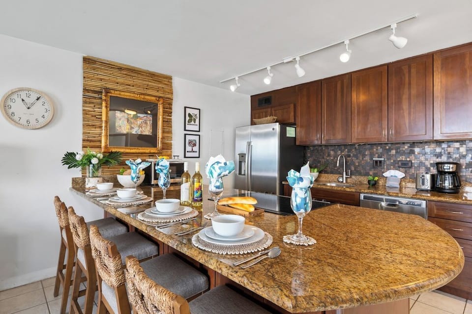 Spacious kitchen featuring stainless steel appliances and a large island for dining or meal prep