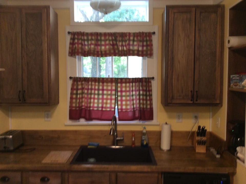 Kitchen sink with sunny window view