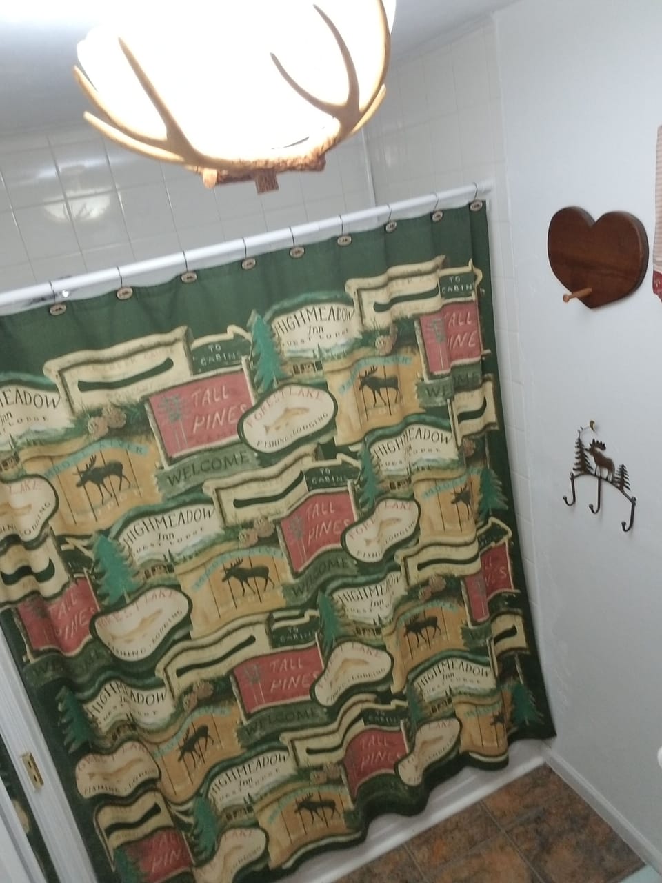 Bathroom #2 with tub/shower, toilet and sink.