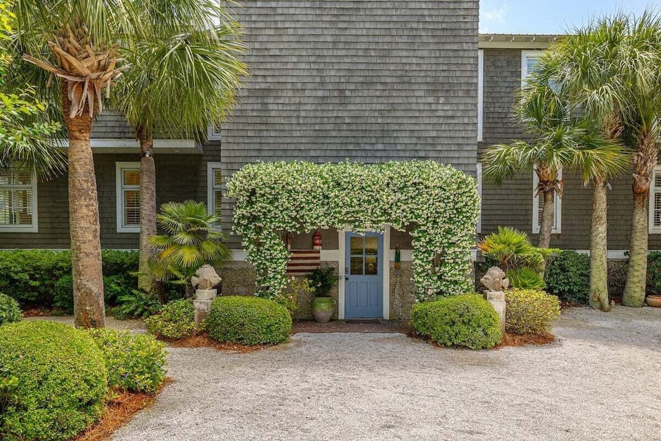Property entrance with ivy-covered garden gate