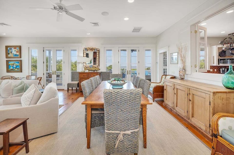 Open living and dining area with French doors and views