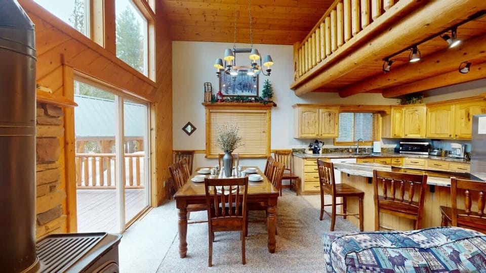 The dining table seats up to 6 with 4 additional seats at the kitchen island.