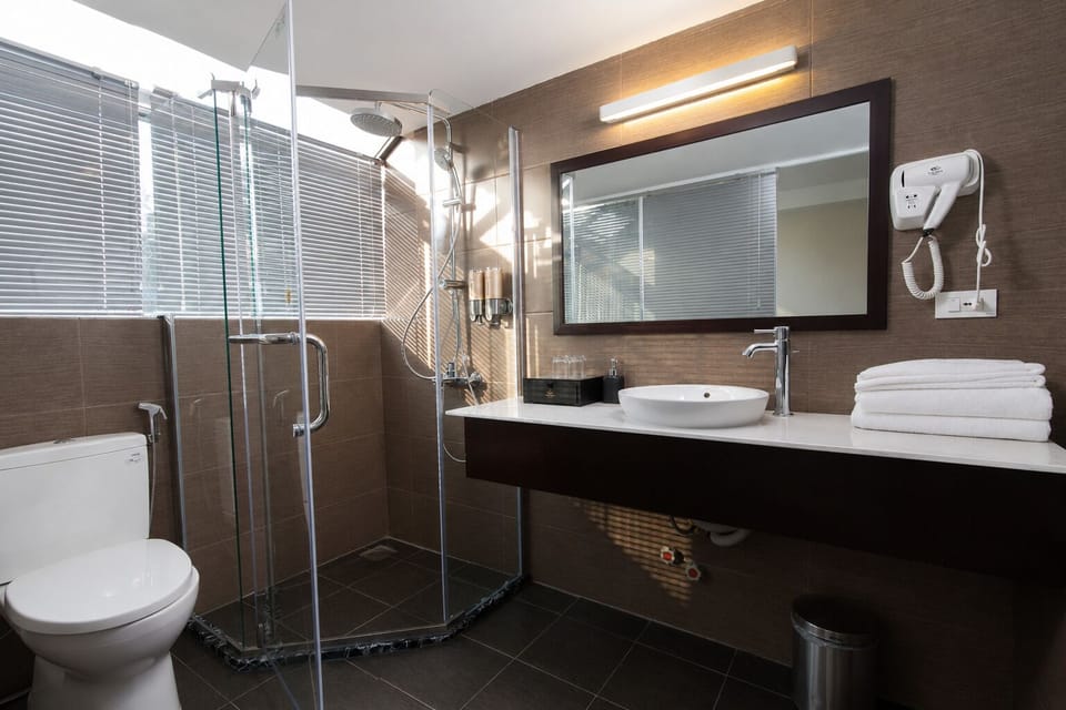 Superior Twin Room | Bathroom | Designer toiletries, hair dryer, bathrobes, slippers