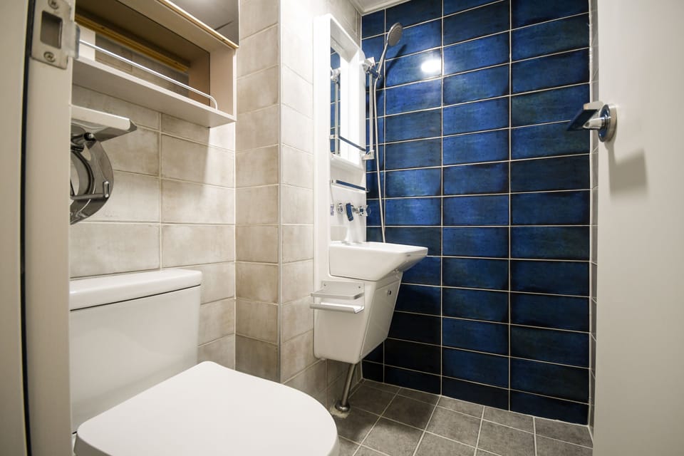 Twin Room | Bathroom | Shower, designer toiletries, hair dryer, slippers