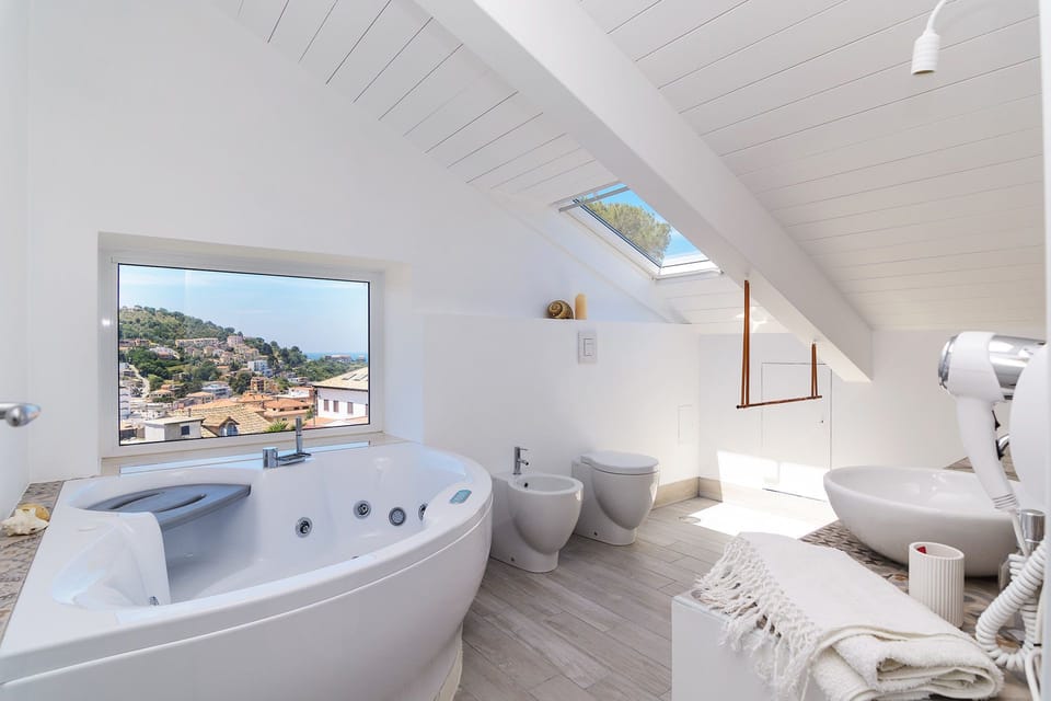 Suite, Sea View (Libeccio) | Bathroom | Shower, free toiletries, hair dryer, bidet