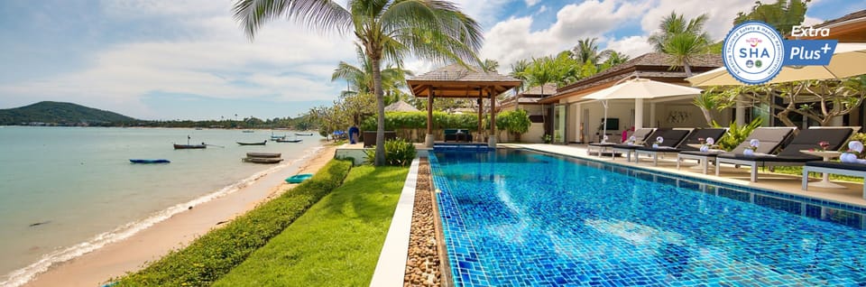 Outdoor pool, an infinity pool, pool umbrellas, sun loungers