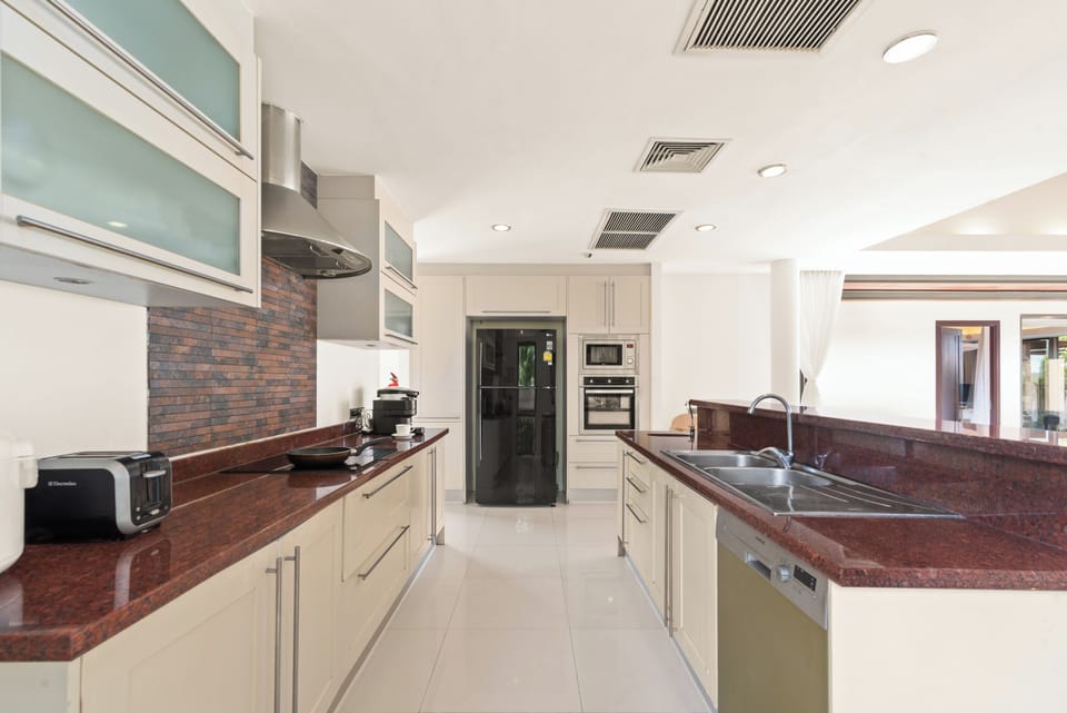 Villa (4 Bedrooms) | Private kitchen | Coffee/tea maker, full-size fridge, microwave, oven
