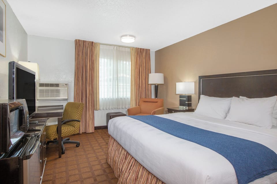 Basic Suite, 2 Bedrooms | Desk, blackout drapes, iron/ironing board, free WiFi