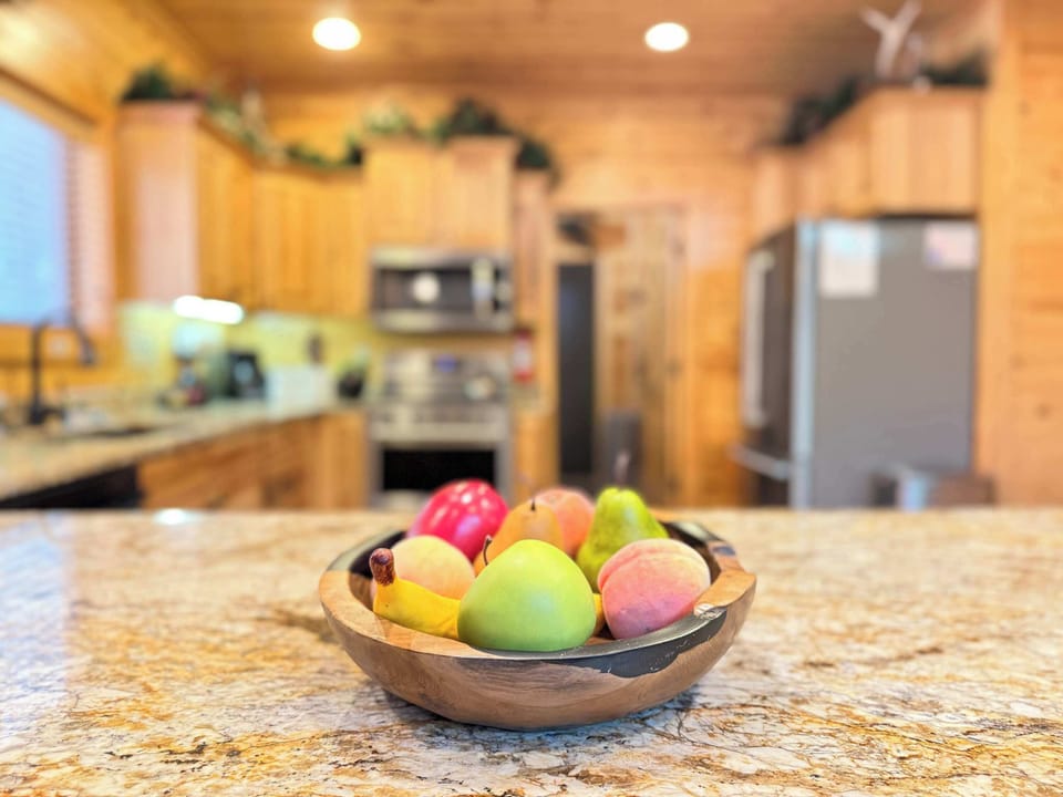 Every detail is designed for comfort. The expansive granite kitchen island offers plenty of open prep space to prepare fresh ingredients for your group.