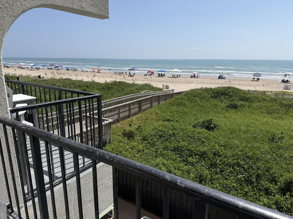 Ocean view from the 2nd floor balcony shows the walkway to the beach.