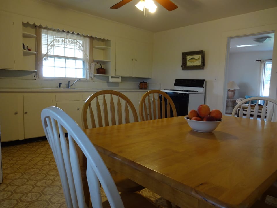The farmhouse kitchen is roomy with eat-in dining space.