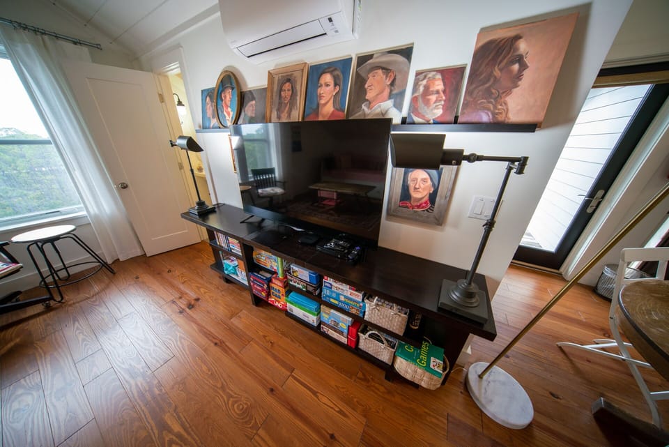 Loft Bedroom, with a lot of games, beautiful art, and plenty of room to spread out.