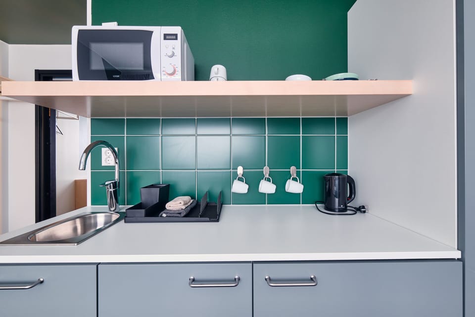Standard Triple Room, Accessible, Kitchenette | Private kitchenette | Shared fridge, microwave, coffee/tea maker, electric kettle