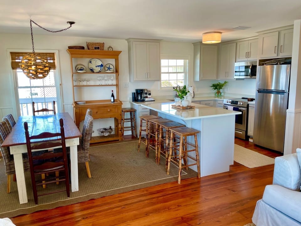 Dining table seats 8; island seats 4 comfortably. There is also dining outside 