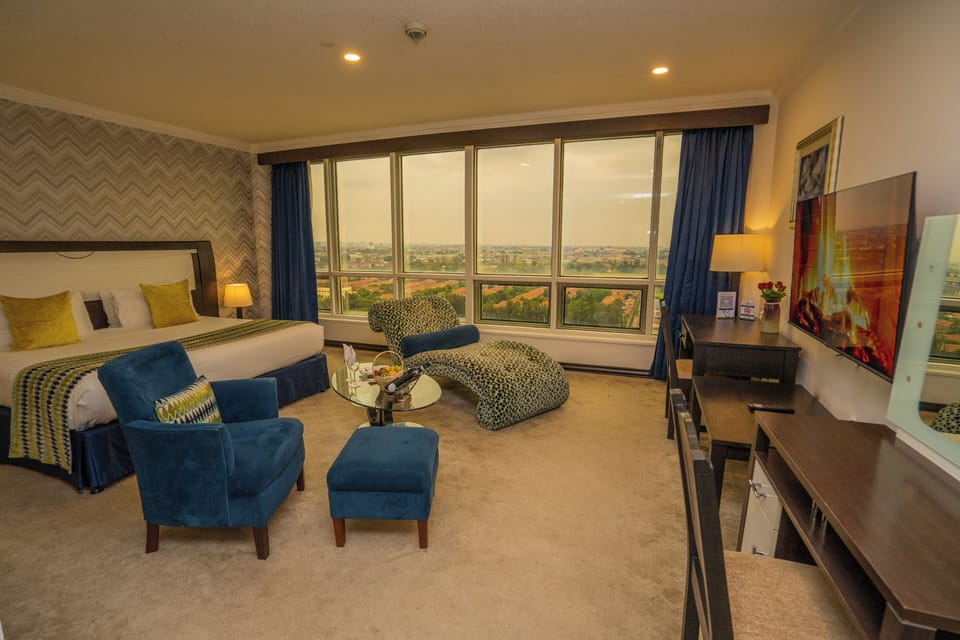 Executive Room with Skyline View | Premium bedding, minibar, in-room safe, desk