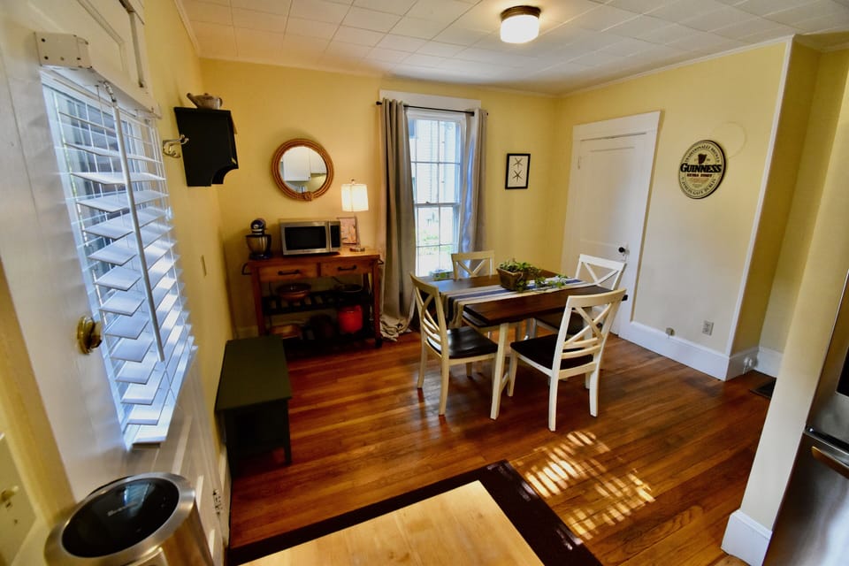 Kitchen dining area with door to back deck and yard