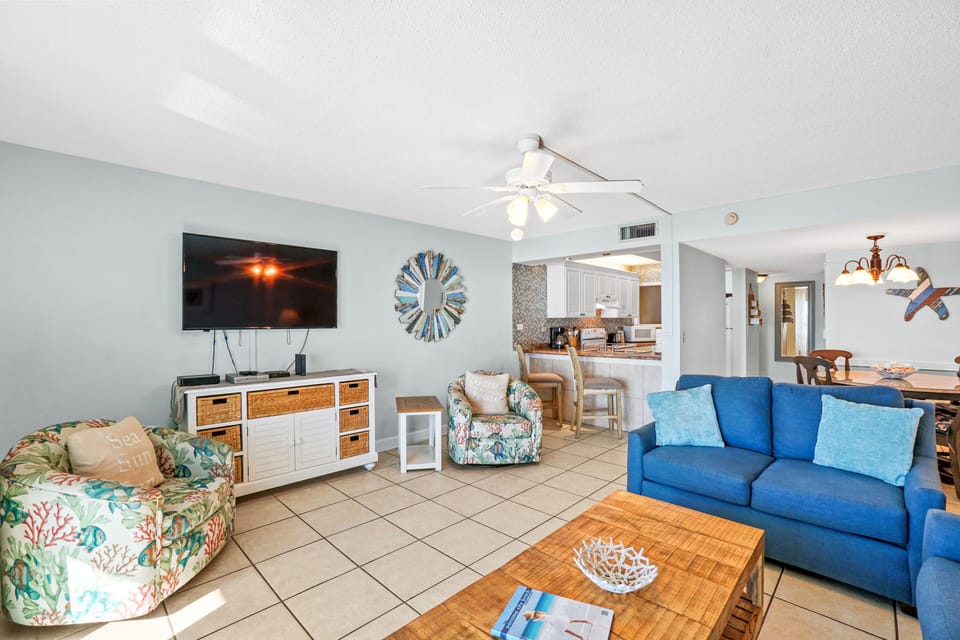 Spacious living room w/ sleeper sofa, loveseat, smart TV, & 2 accent chairs.