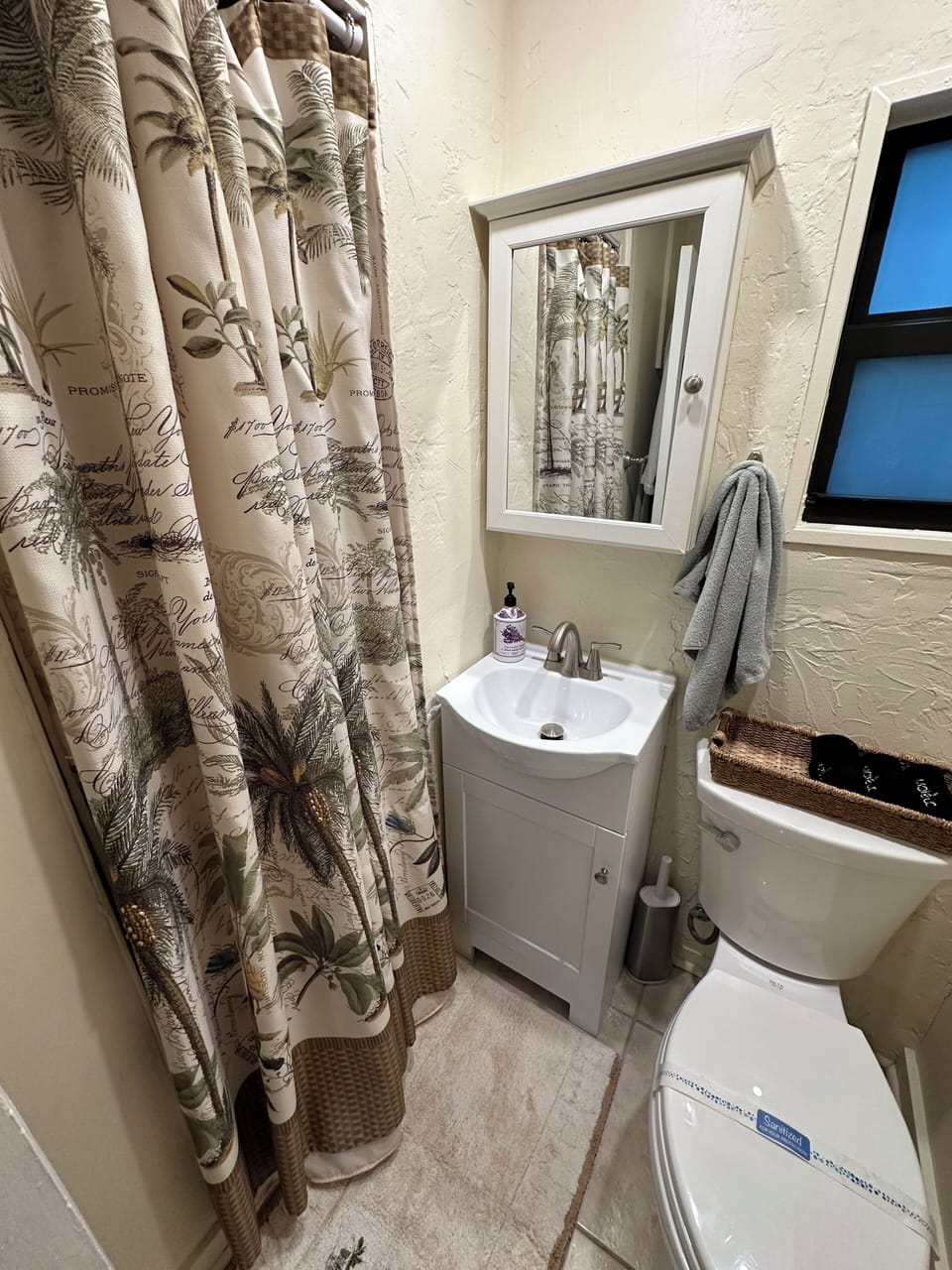 An equipped bathroom with a shower and things you didn't know you would need.