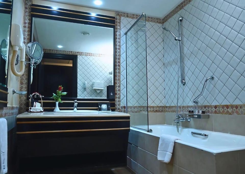 Single Room | Bathroom | Designer toiletries, hair dryer, bathrobes, slippers