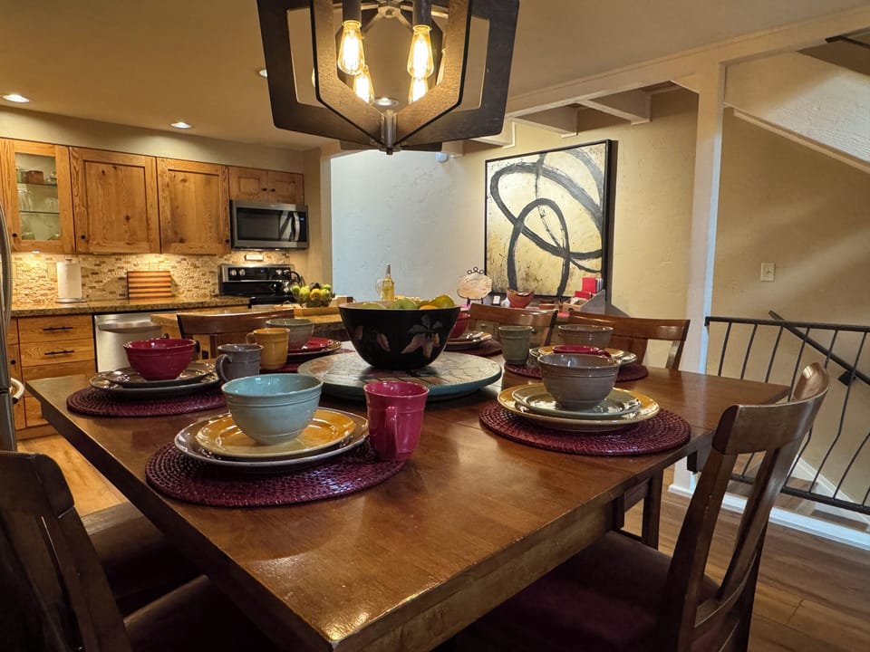 The dinning table currently sits 6, but can be expanded to seat 8.