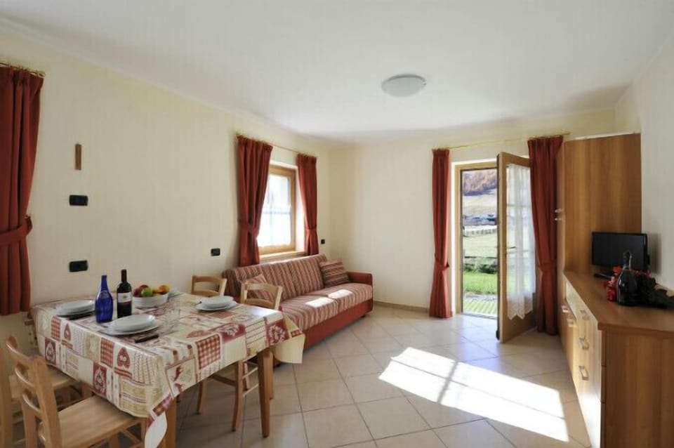 Open plan living room and kitchen with dining area