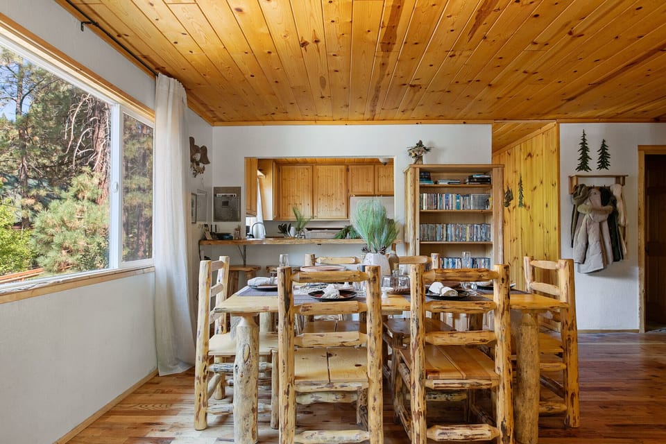 Dining area with 6 person table and 4 person breakfast bar