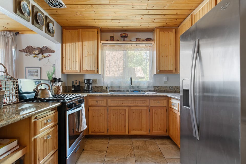 Large kitchen with stainless appliances and granite counters